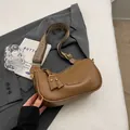 Vintage brown leather crescent bag with adjustable ethnic style woven shoulder strap - Khaki