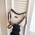 Chic beige canvas and brown leather shoulder bag with a beaded wood pendant accessory - Off-White Large With Pendant