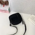 Minimalist black corduroy square crossbody bag with adjustable strap and front pocket - Black