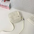 Chic beige corduroy crossbody bag with square design and adjustable canvas shoulder strap - White