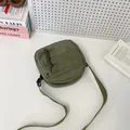 Minimalist olive green corduroy shoulder bag with front flap pocket and zipper closure - Green
