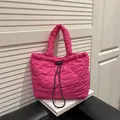 Magenta heart-quilted puffy dumpling bag with black and white drawstring straps - Rose Pink