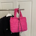 Bright pink heart-quilted dumpling bag with adjustable drawstring and lightweight design - Rose Pink