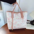 Large tote bag with pink bear graffiti print and shoulder straps in street style - Pink