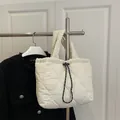 White quilted heart-pattern dumpling bag with adjustable drawstring closure for women - White