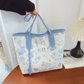 White tote bag with blue cartoon graffiti print and light blue handles for women - Blue