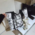 Large graffiti tote bag in white PU leather with cute bunny charm and black print - With Pendant / Black