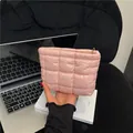 Pink quilted nylon storage bag with golden zipper in a compact square design - Pink