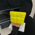 Neon lime quilted puffer clutch bag with waterproof nylon texture in a minimalist style - Yellow