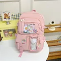 Rosa Schulrucksack mit vielen Taschen, Sichtfenstern und niedlichem Plüschbären-Anhänger - Rosa