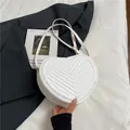 Stylish white heart-shaped crossbody bag with V-quilted faux leather and adjustable strap - White