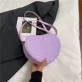 Fashionable purple heart-shaped crossbody bag with V-quilt stitching and gold hardware - Purple