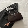 Dark brown glossy leather shoulder bag with exterior pocket and vintage bowling style - No Pendant / Coffee