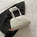 Minimalist white PU leather shoulder bag with front pocket and round snap button detail - No Pendant / White