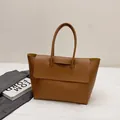 Brown leather large tote bag with long handles and yellow interior for daily commute - Brown