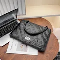 Quilted black laptop tote bag with bow texture pattern and stylish top handles - Bow Quilted Handbag / 39x29x2cm / Black