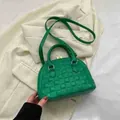 Green quilted handbag with cross-hatched pattern and top handles in a shell shape - Green