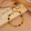 Bracelet luxueux en acier inoxydable doré avec pierres ovales colorées et fermoir mousqueton - Style Zircone Ovale / Multicolore