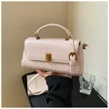 Elegant pale pink mini square bag with metallic turn-lock and top handle - Pink