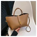 Brown lychee leather tote bag with gold buckle and shoulder strap for women - Brown