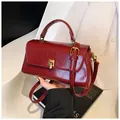 Classic burgundy leather square handbag with gold hardware and top handle for women - Red
