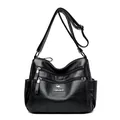 Black lychee texture crossbody bag with multiple zippers and kangaroo logo detail - Black