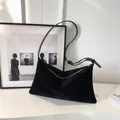Minimalist black suede tote bag with adjustable leather strap and zipper closure - Black