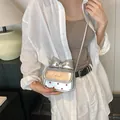 Mini borsa a tracolla argento con grande fiocco e pois rossi in pelle metallizzata - Argento