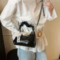 Fashionable black glossy ruched cloud bag with pearl heart charm and lace bow detail - Black