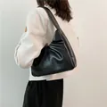 Fashionable black pleated dumpling shoulder bag in premium vegan leather for women - Black