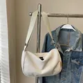 Minimalist cream white corduroy crossbody bag with a textured finish and black zipper - White
