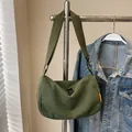 Army green corduroy crescent crossbody bag with ribbed texture and wide strap - Green