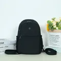Minimalist black nylon backpack with metal logo and multi-pocket functional design - Black