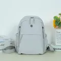 Minimalist light gray casual backpack with multi-pocket design for commuting or outdoor use - Light Gray