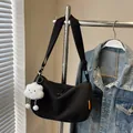 Black corduroy crescent crossbody bag with cute cloud plush charm and fabric strap - Black + Cloud Pendant