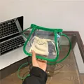 Minimalist transparent PVC crossbody bag with vibrant green trim and a beige drawstring pouch - Green