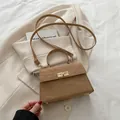 Chic camel wrinkled leather crossbody bag with vintage gold turn-lock and top handle - Khaki