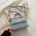 Chic light blue crossbody bag with gold twist lock and crinkle texture for women - Blue