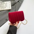 Elegant deep red velvet quilted crossbody bag with gold metal chain strap and clasp - Red