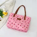 Pink tote bag with cherry print and brown leather handles for women stylish commuting - Pink