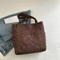 Brown corduroy strawberry print tote bag with wide textile handles and front pocket - Brown