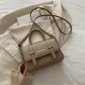 Khaki pebbled leather box bag with silver buckle and FASHION & BAGS lettering - Khaki