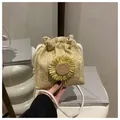 Detail of woven straw bucket bag with sunflower decor and white cotton rope strap - Khaki With Yellow