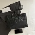 Minimalist black tote bag with wrinkled texture and silver metallic logo for daily commute - Black without Pendant