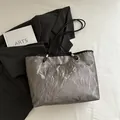 Metallic silver tote bag with crinkled texture, slim black straps and metal logo - Grey Without Pendant
