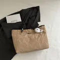 Large camel tote bag with crinkle texture, black leather straps and plush monster charm - Khaki With Pendant