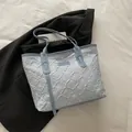 Light blue floral embroidered tote bag with pleated texture and brand tag for women - Blue Without Charm