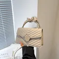 Quilted beige crossbody bag with pleated cloud handle and square metal buckle - Khaki