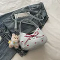 Light blue shoulder bag with red bows, heart charm, and plush bear keychain - With Pendant / Light Blue