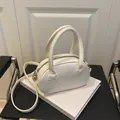 Elegant white leather bowling bag with bow-knot details and crossbody strap - White